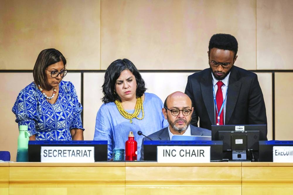 
Chairman of the negotiations on global treaty on plastic pollution Ecuadorian ambassador Luis Vayas Valdivieso (second right) looks on with members of his office prior to the opening of a plenary assembly in Geneva yesterday. 