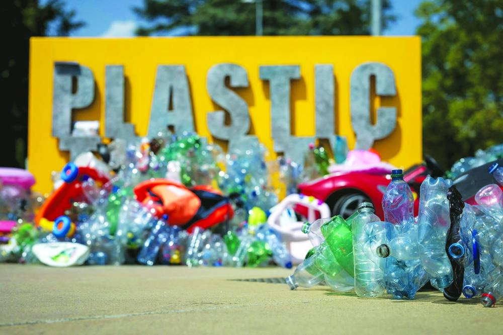 An artwork by Canadian artist, activist, and photographer Benjamin Von Wong entitled "The Thinker's Burden" a 6-meter-tall sculptural remix of Rodin's iconic Thinker, which is being created for the Plastics Treaty Negotiations is seen in front of the United Nations Offices in Geneva on August 13, 2025. Negotiators from 184 countries remained riven on how to curb plastic pollution, less than 36 hours before they were slated to deliver a binding global treaty. (Photo by Fabrice COFFRINI / AFP) / RESTRICTED TO EDITORIAL USE - MANDATORY MENTION OF THE ARTIST UPON PUBLICATION - TO ILLUSTRATE THE EVENT AS SPECIFIED IN THE CAPTION