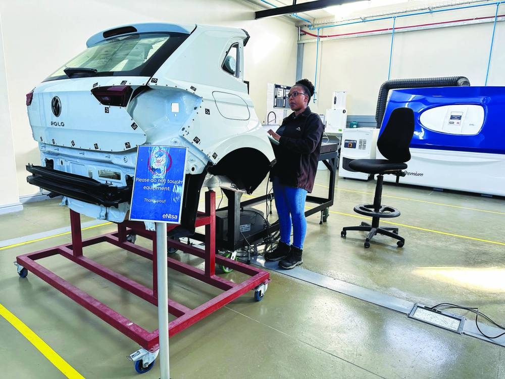 
A female engineer tests motor vehicle panels at Nelson Mandela University in Gqeberha, as the annual South African vehicle component manufacturers conference takes place, with a particular focus on how the industry is adapting to US tariffs, in Gqeberha, the Eastern Cape province of South Africa. 