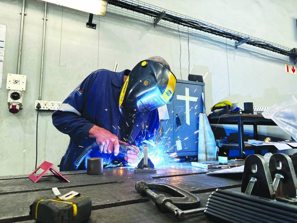 
An automotive engineer welds components used in the automotive industry at Nelson Mandela University in Gqeberha. 
