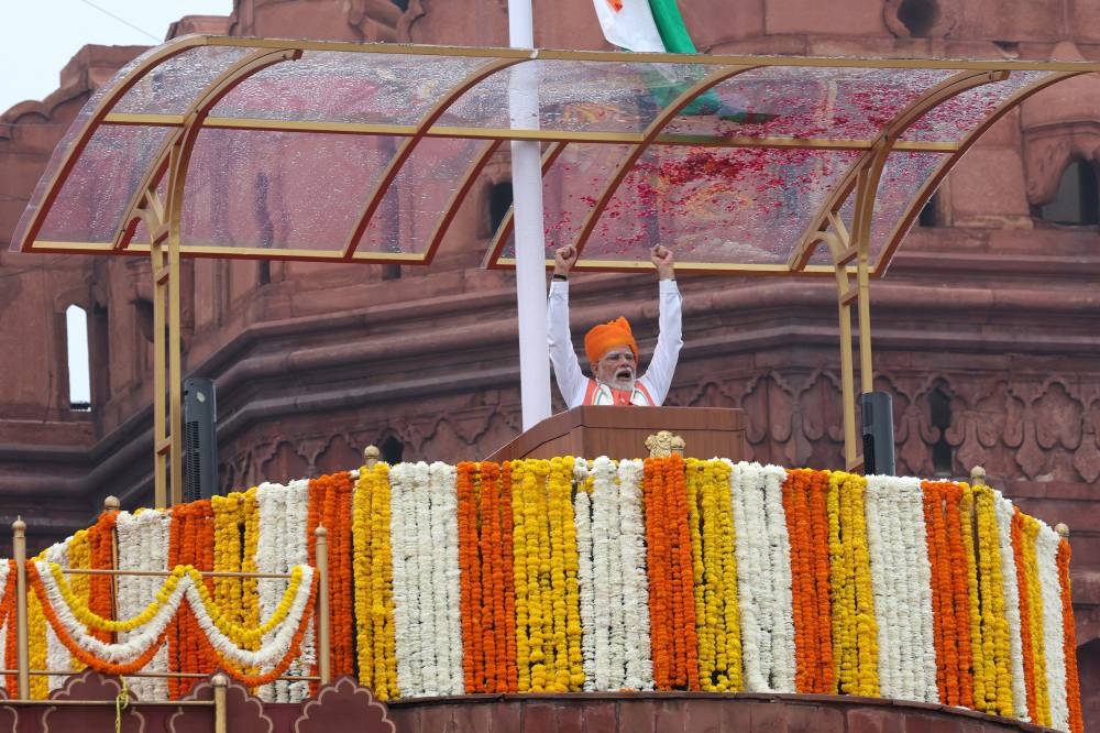 India's Prime Minister Narendra Modi raises his arms after addressing the nation during Independence Day celebrations at the historic Red Fort in Delhi, India, August 15, 2025. REUTERS