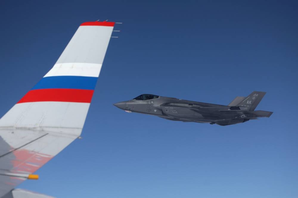 A US F-22 fighter jet escorts a plane with Russian President Vladimir Putin on board following a US-Russia summit in Anchorage, Alaska, on Saturday. AFP
