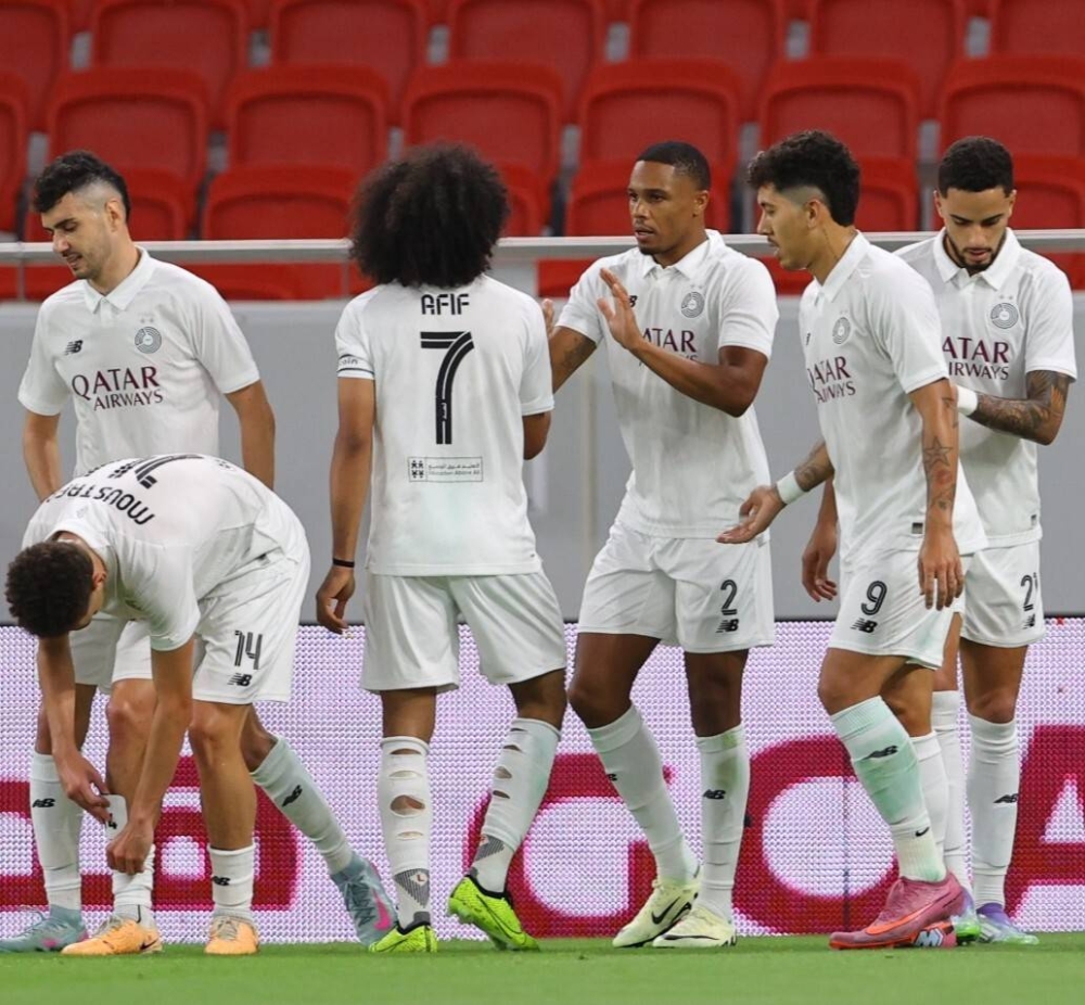 Pedro Miguel celebrates wtih Akram Afif after he scored Al Sadd's second goal against Al Ahli in the second round of QSL at Al Thumama Stadium Thursday.