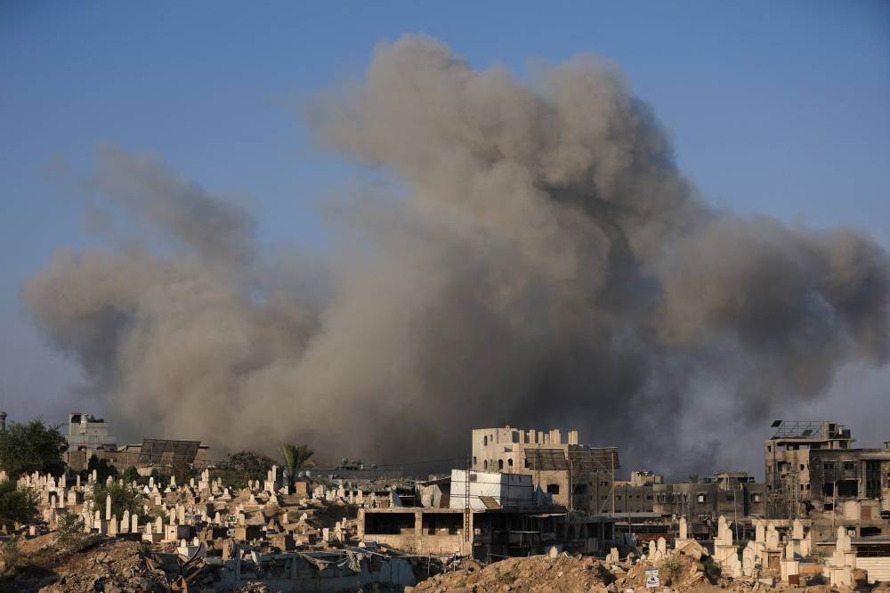 Smoke rises following an Israeli strike, in Gaza City, August 23, 2025. REUTERS