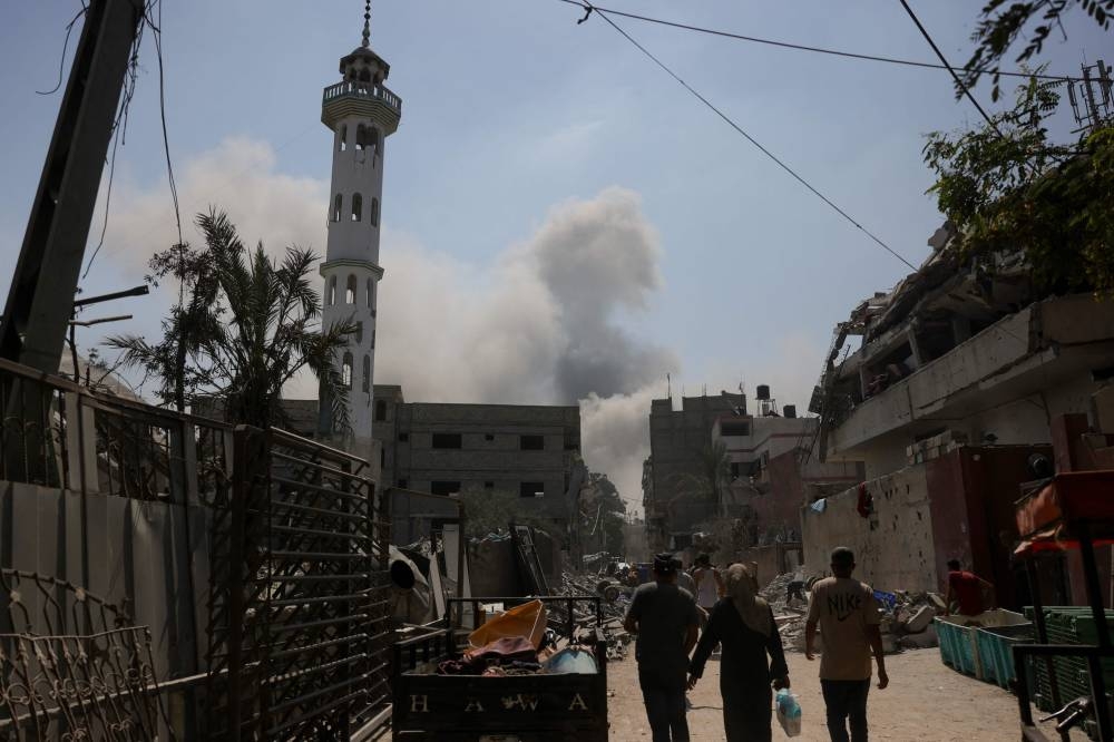 Smoke billows after an Israeli strike in Jabalia in the northern Gaza Strip (AFP)