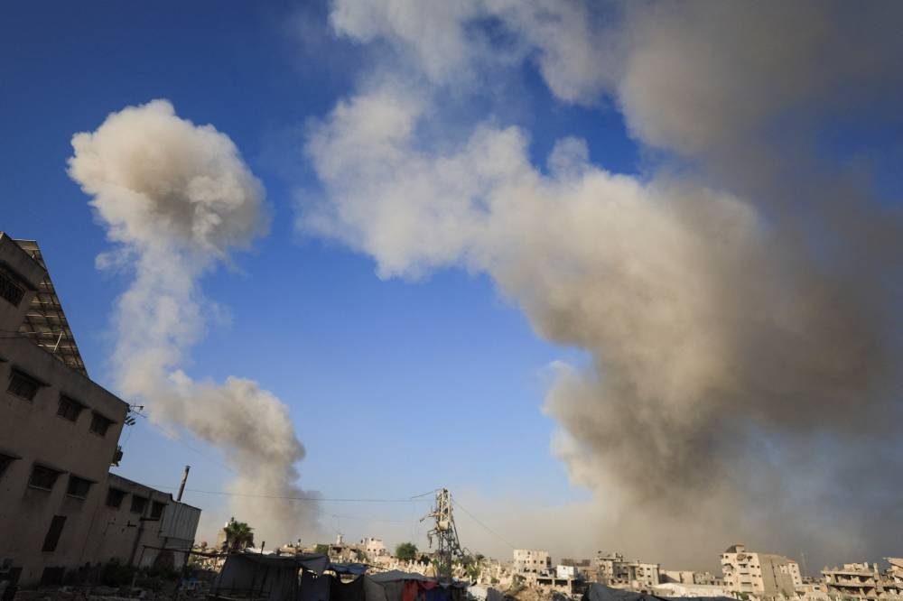 Smoke rises following an explosion during an Israeli operation, in Gaza City, August 26, 2025. REUTERS/Dawoud Abu Alkas