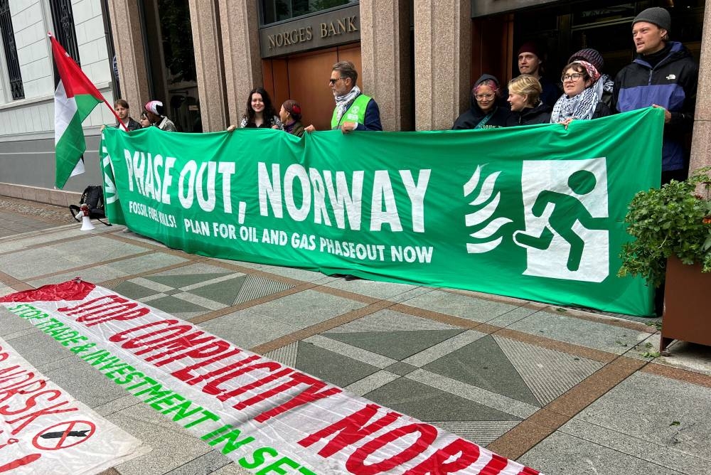 Pro-Palestinian and climate change activists block the entrances of the Norwegian central bank, which houses the offices of the sovereign wealth fund, in Oslo, Norway, on Friday. Reuters