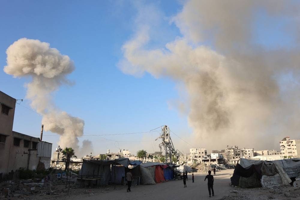 Smoke billows after an Israeli army operation in the Zeitoun neighbourhood of Gaza City, on Tuesday. AFP