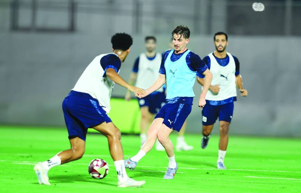 Al Duhail players in action during a training session Wednesday.