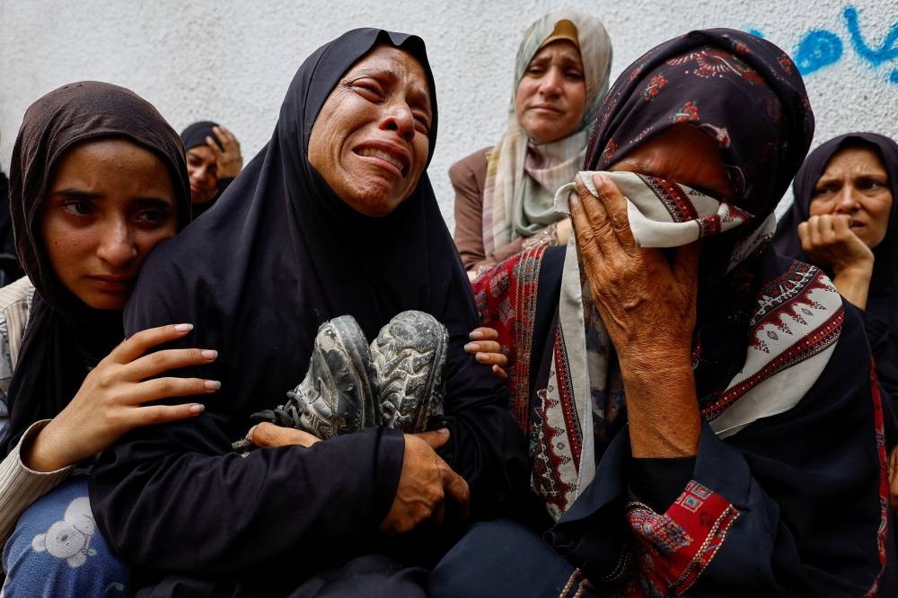 Mother of Khaled Al-Shinbari, a Palestinian teenager who was killed in Israeli fire on Wednesday while seeking aid in northern Gaza. REUTERS