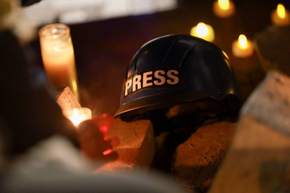 A head gear used by the members of the press, is displayed at a vigil and rally honoring the lives of journalists and medics killed on Monday in Israeli strikes on Nasser hospital in Khan Younis, in the southern Gaza Strip, outside Union Station in Washington, D.C., U.S., August 27, 2025. REUTERS