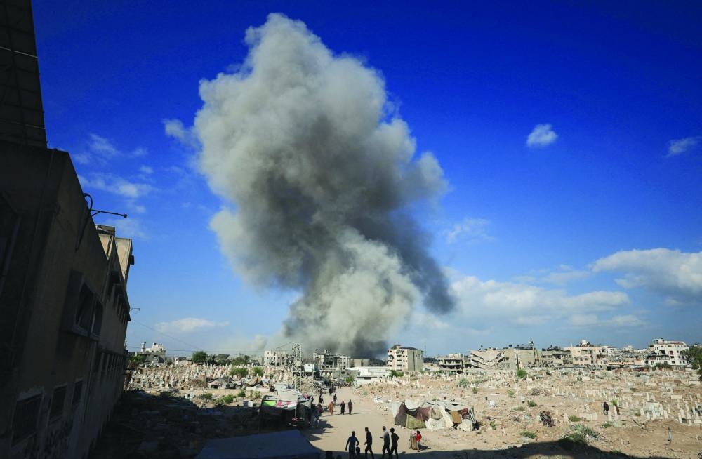 Smoke rises following an explosion during an Israeli operation in Gaza City Thursday. (Reuters)