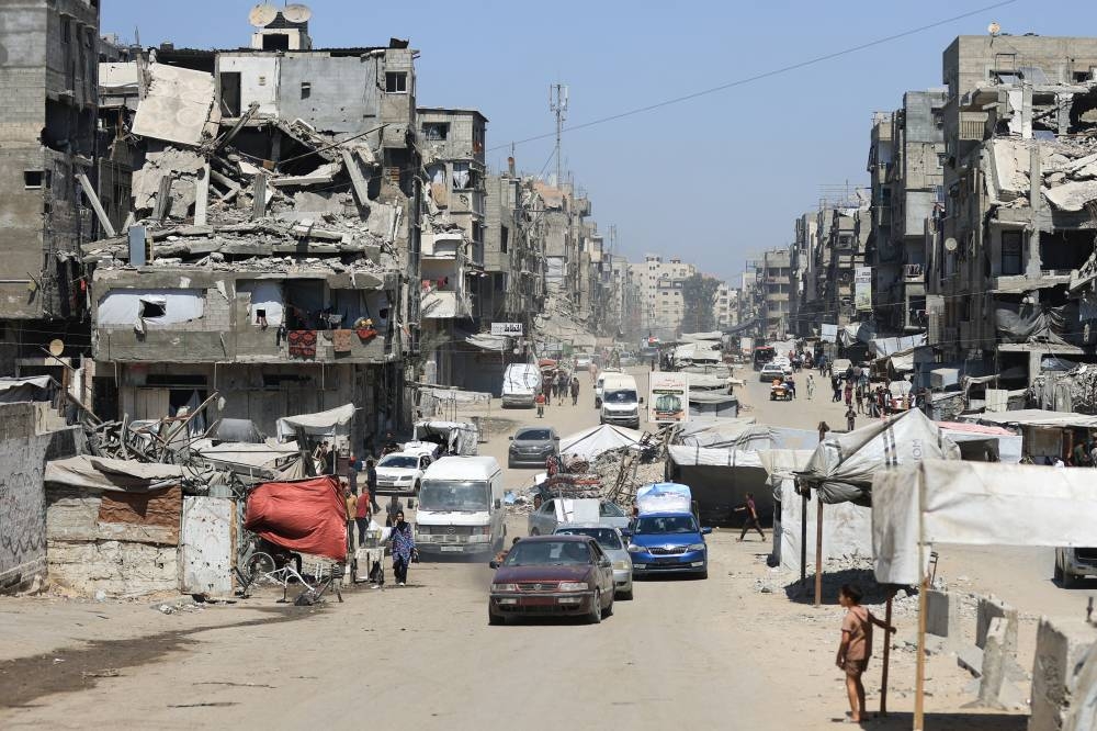 Displaced Palestinians make their way as they flee from one area to another within Gaza City, amid an Israeli military operation, in Gaza City