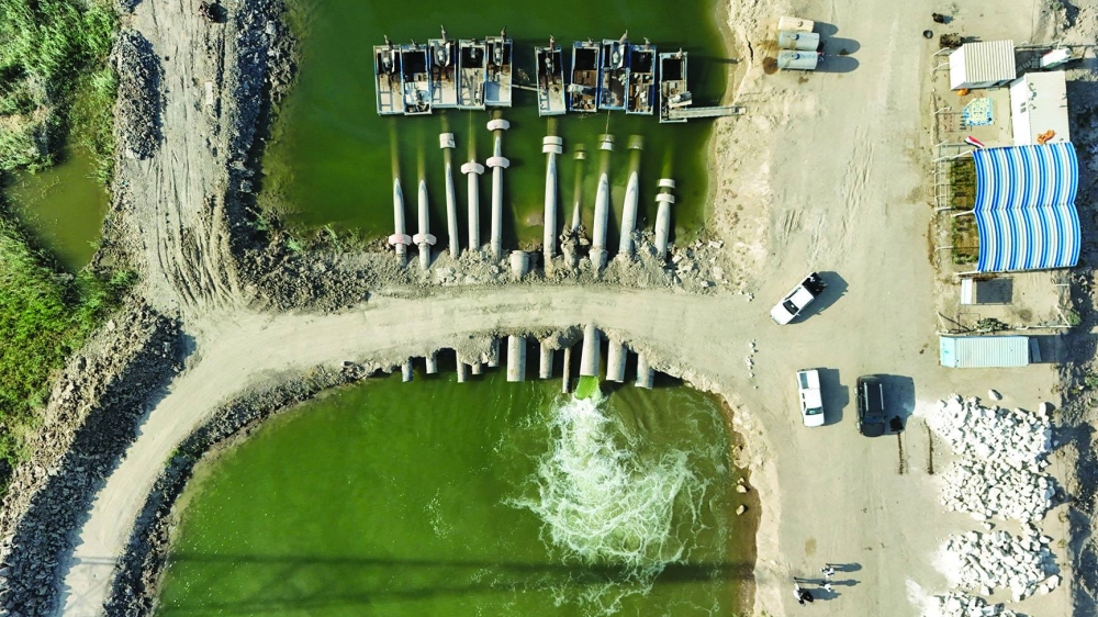 A drone view shows a water pumping system operating on the banks of the Euphrates River to irrigate marsh areas affected by drought in Basra, Iraq.
