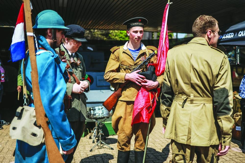 Cosplayers stand outside the Comic Con Africa Nasrec Expo Centre in Johannesburg, Saturday.