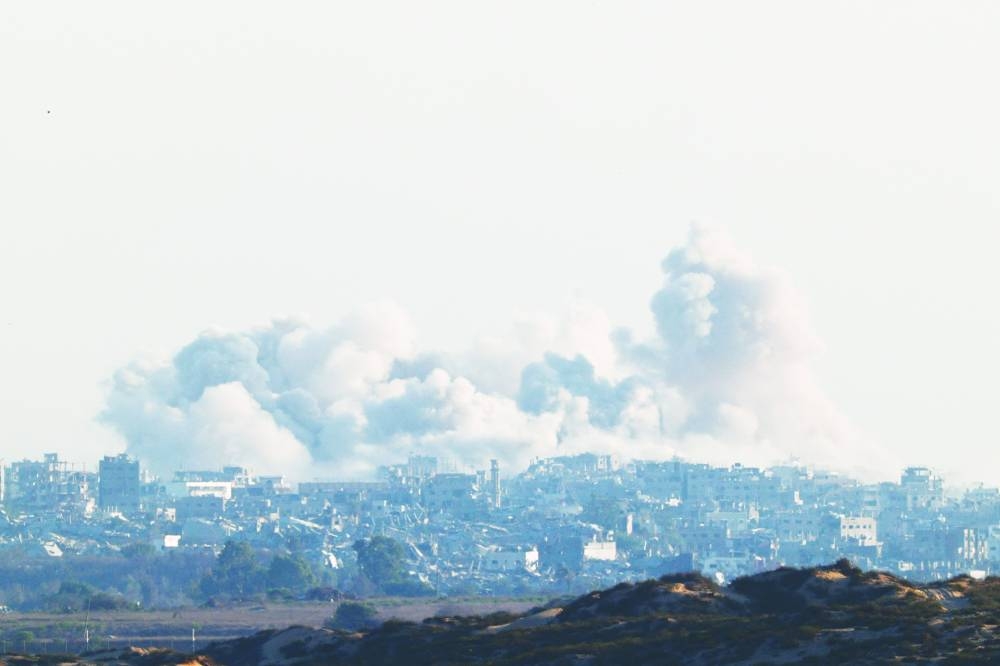Smoke rises after an explosion in Gaza Thursday. (Reuters)