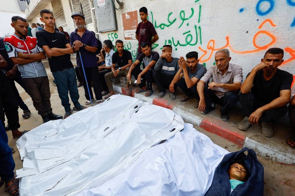 SENSITIVE MATERIAL. THIS IMAGE MAY OFFEND OR DISTURB

Mourners gather around the bodies of Palestinians killed in overnight Israeli strikes, according to medics, during their funeral at Al-Shifa Hospital in Gaza City, September 5, 2025. REUTERS