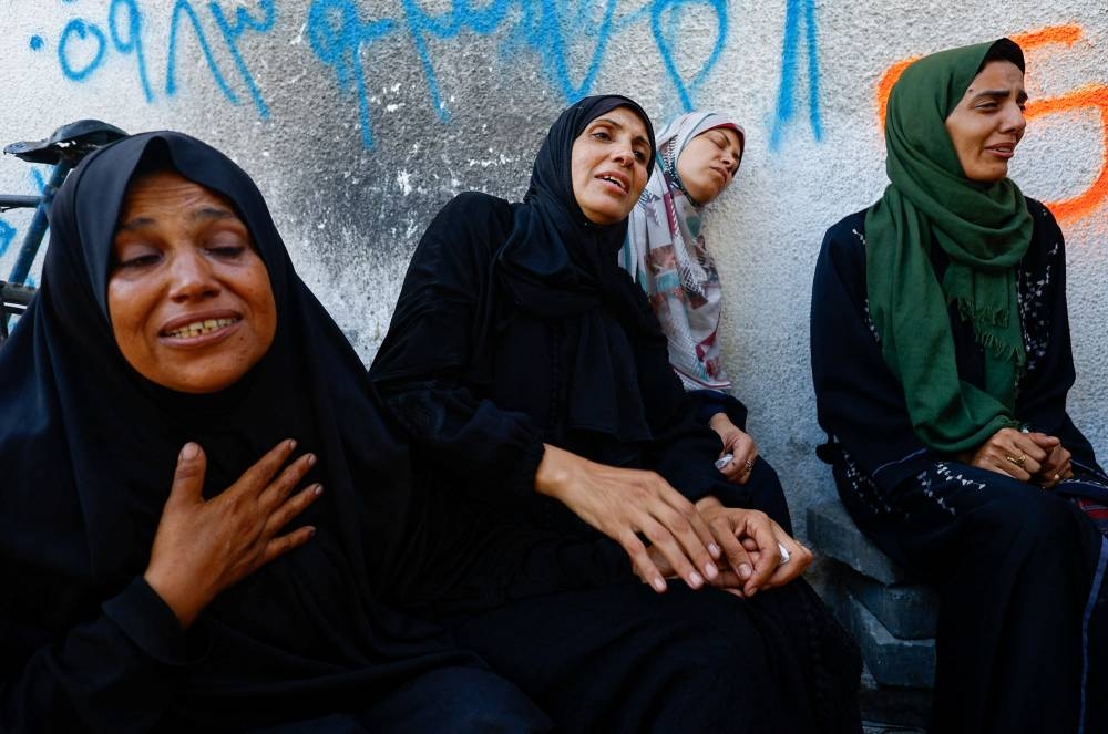 Mourners react during the funeral of Palestinians killed in overnight Israeli strikes, according to medics, at Al-Shifa Hospital in Gaza City, September 5, 2025. REUTERS
