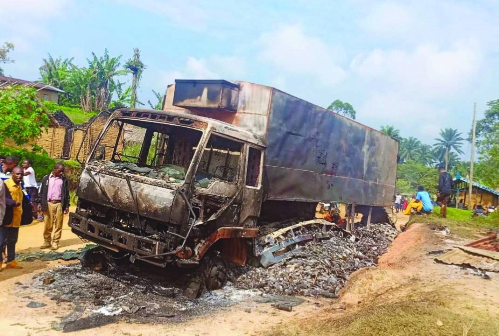 A charred wreckage of a truck stands on a road after it was burnt following an attack by Islamic State-affiliated Allied Democratic Forces (ADF) rebels, in the town of Ntoyo in North Kivu province&#039;s Lubero territory, eastern Democratic Republic of Congo, on Tuesday.