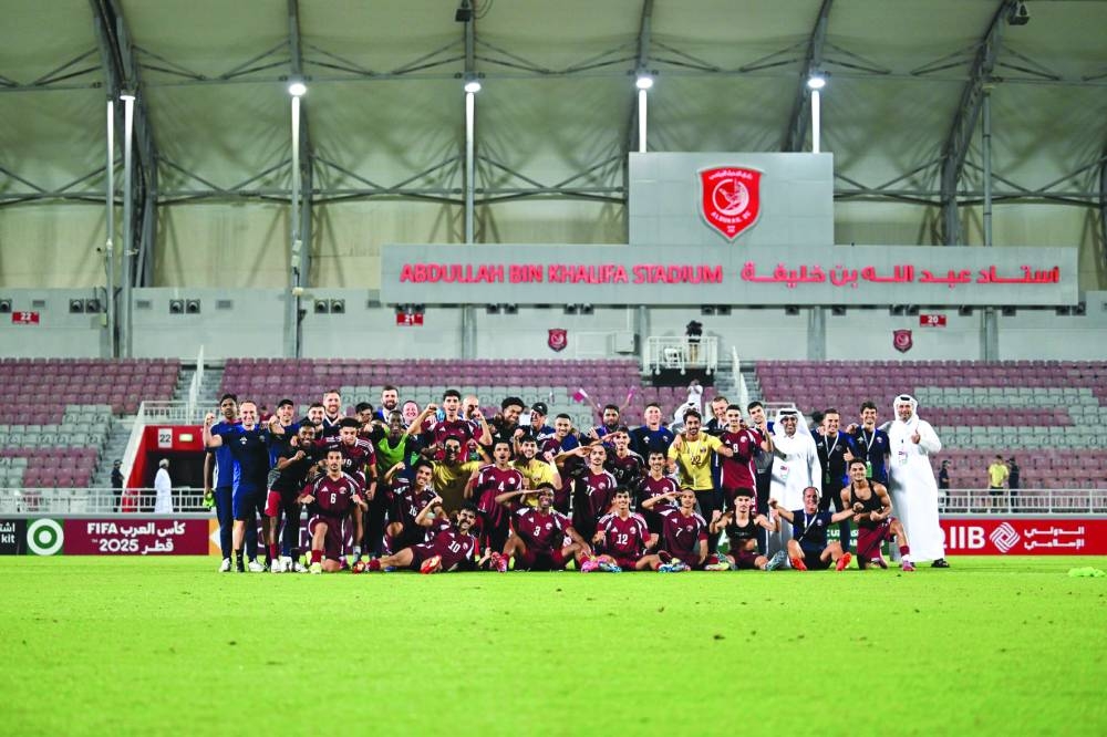 
Qatar U-23 squad and staff celebrate after the qualification for the 2026 Asian Cup. 