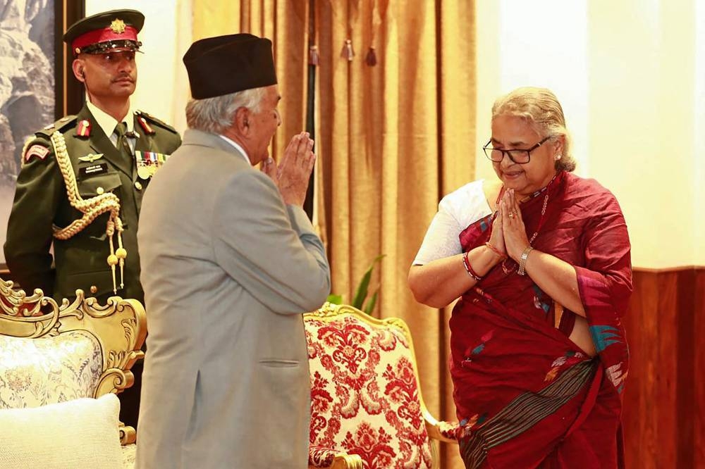 Nepal's President Ram Chandra Paudel (L) gestures after administering the oath to the country's newly appointed Prime Minister Sushila Karki during her swearing-in-ceremony at the President House in Kathmandu on Friday. AFP