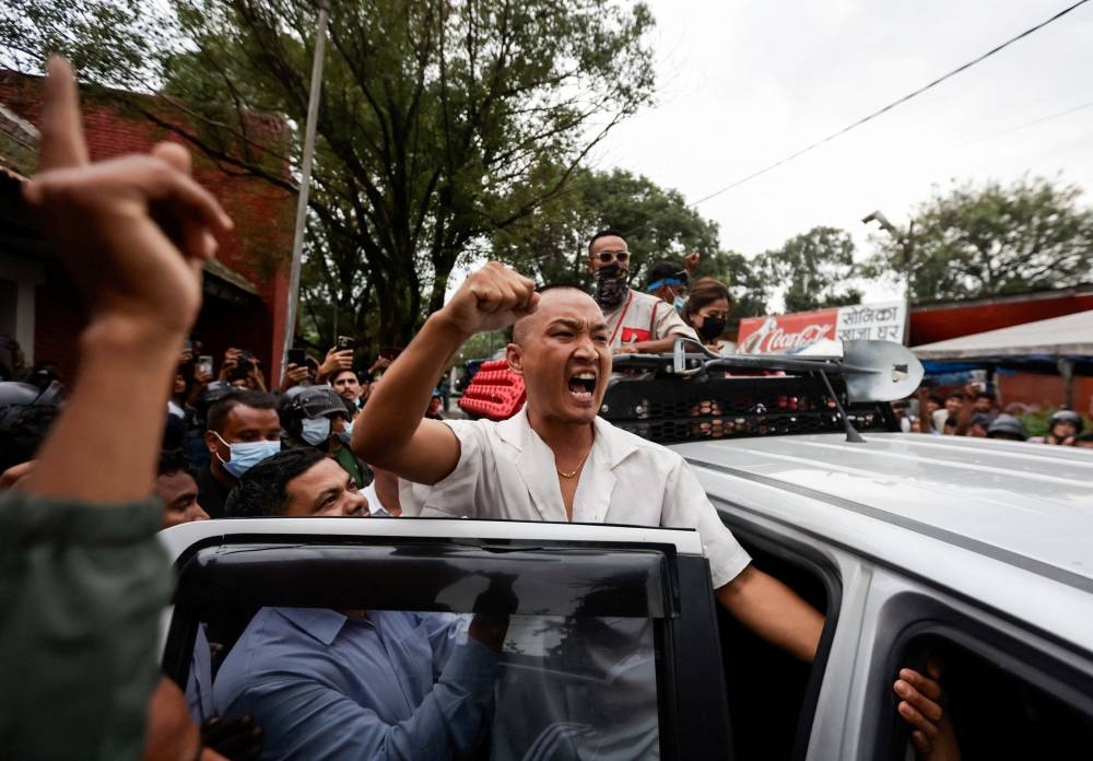 Sudan Gurung, 36, founder of Hami Nepal, shouts as he returns after a brawl during their press conference, following last week's deadly anti-corruption protests, in Kathmandu, Nepal, on Sunday. REUTERS