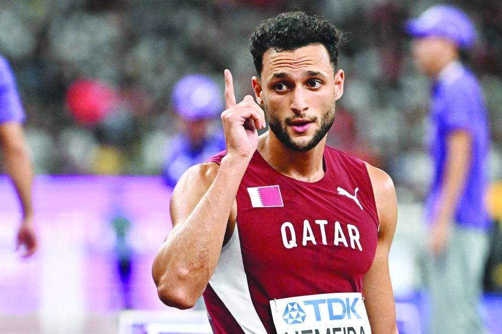 Qatar's athlete Bassem Hemeida reacts after competing in the men's 400m hurdles heats during the World Athletics Championships in Tokyo, on Monday. AFP
