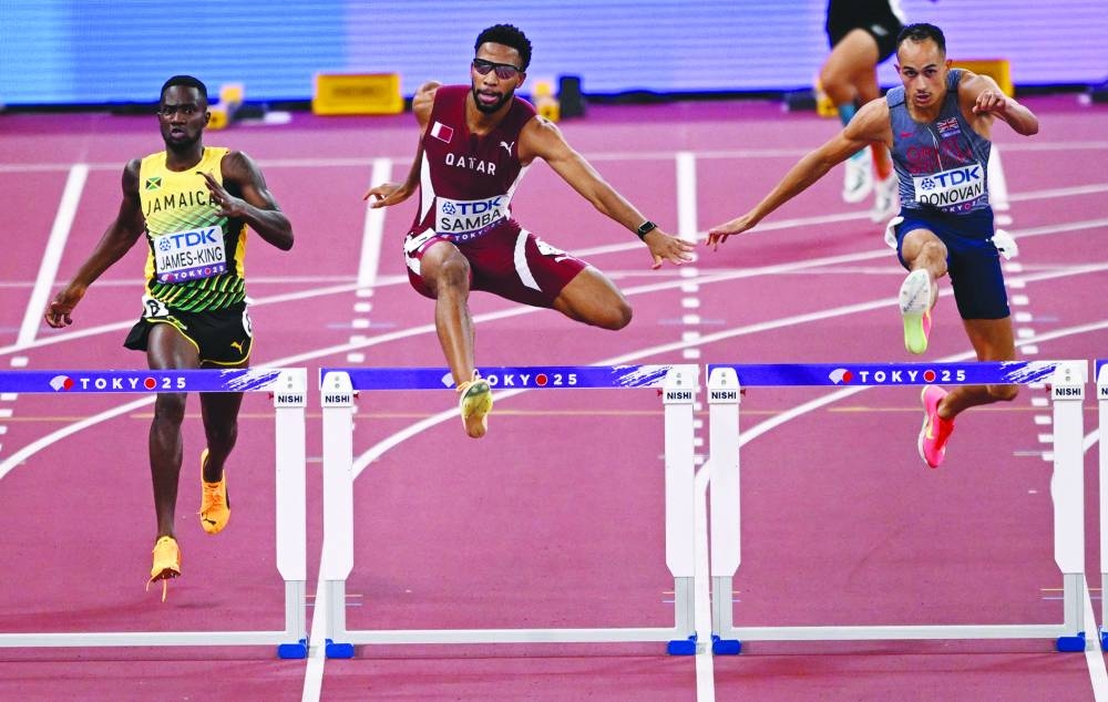 Qatar's Abderrahman Samba in action with Britain's Tyri Donovan and Jamaica's Malik James-King during heat 1. REUTERS