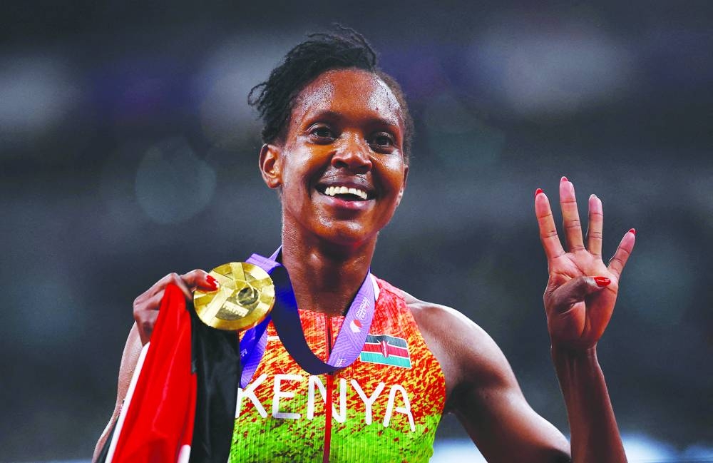 Gold medallist Kenya's Faith Kipyegon celebrates after winning the women's 1500m final. REUTERS