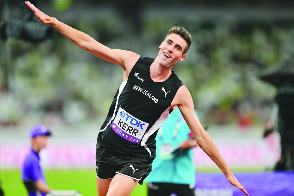 New Zealand's Hamish Kerr celebrates after winning the high jump gold. AFP