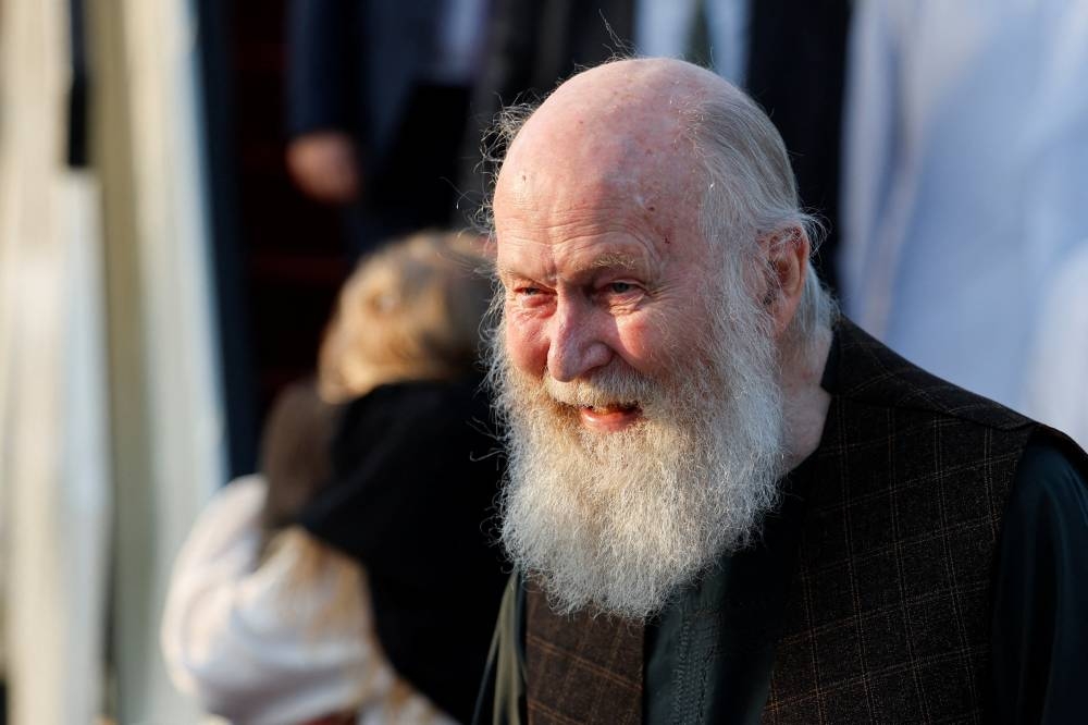 Peter Reynolds, who was released from Taliban detention in Afghanistan, disembarks from a plane, in Doha, Qatar. REUTERS