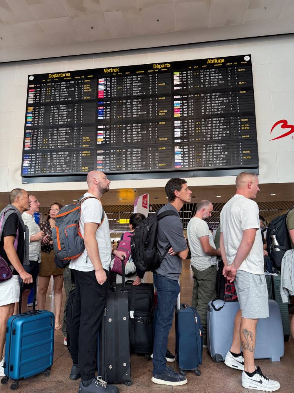 Travellers wait in queues at Brussels airport, after a cyberattack at a service provider for check-in and boarding systems disrupted operations at several major European airports, in Zaventem near Brussels, Belgium September 20, 2025. REUTERS