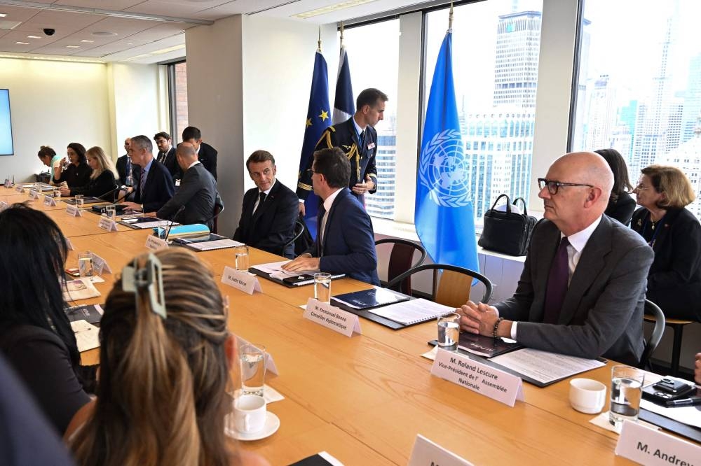 French President Emmanuel Macron meets with members of Israeli and Palestinian civil society in New York on Monday. AFP