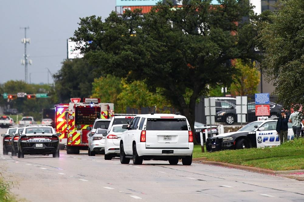 Law enforcement and emergency personnel respond near the scene of a shooting at a US Immigration and Customs Enforcement (ICE) detention facility in Dallas, Texas, on Wednesday. AFP