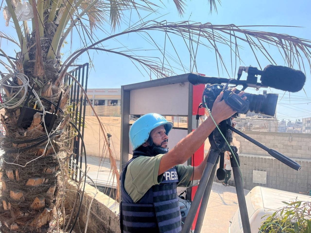 Reuters cameraman Hussam al-Masri, who was killed in Israeli strikes on Nasser hospital on August 25, 2025, works at Nasser hospital, in Khan Younis in the southern Gaza Strip August 7, 2024. REUTERS