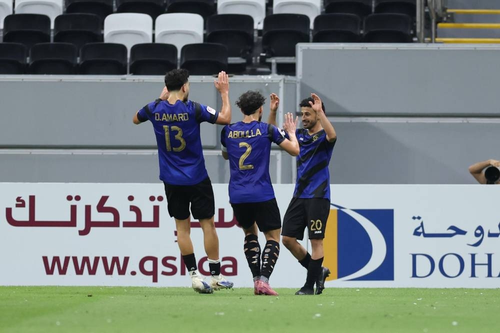 Al Sailiya's Khalid Ali Binsabaa (right) celebrates one of his two goals against Al Arabi at the Al Bayt Stadium.