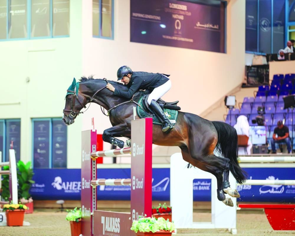 Saudi rider Khalid al-Eid astride Q-Layen in action at Qatar Equestrian Federation’s indoor arena Saturday.