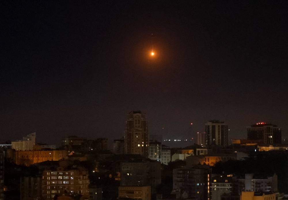 An explosion of a drone is seen in the sky over the city during a Russian missile and drone strike, amid Russia's attack on Ukraine, in Kyiv, Ukraine September 28, 2025. REUTERS