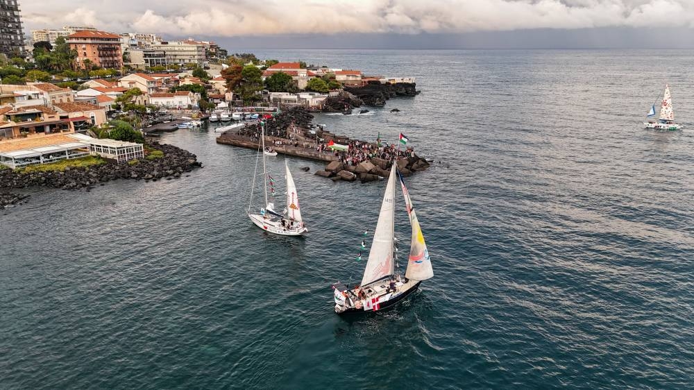 A drone picture shows a flotilla of humanitarian boats led by French activist Melissa, dubbed the “Thousand Madleens,” departing from the Sicilian port of San Giovanni li Cuti in Catania, Italy on Saturday. REUTERS