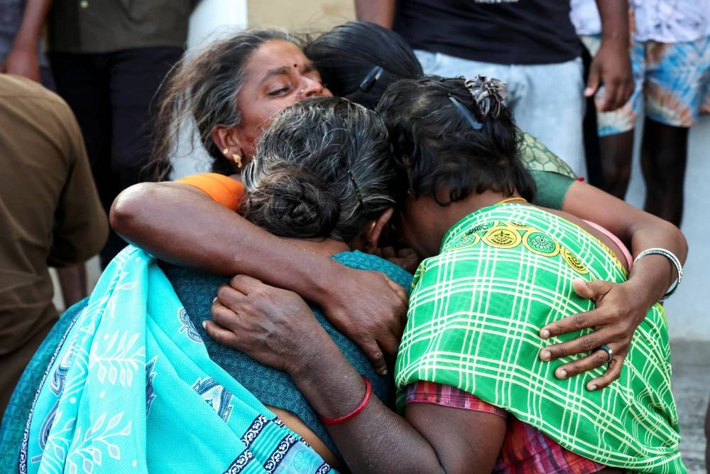 Relatives of the victims mourn in front of Karur Government Medical College hospital following a stampede incident at a election campaign rally held by Tamilaga Vettri Kazhagam party, in Karur district of Tamil Nadu, India, on Sunday. REUTERS