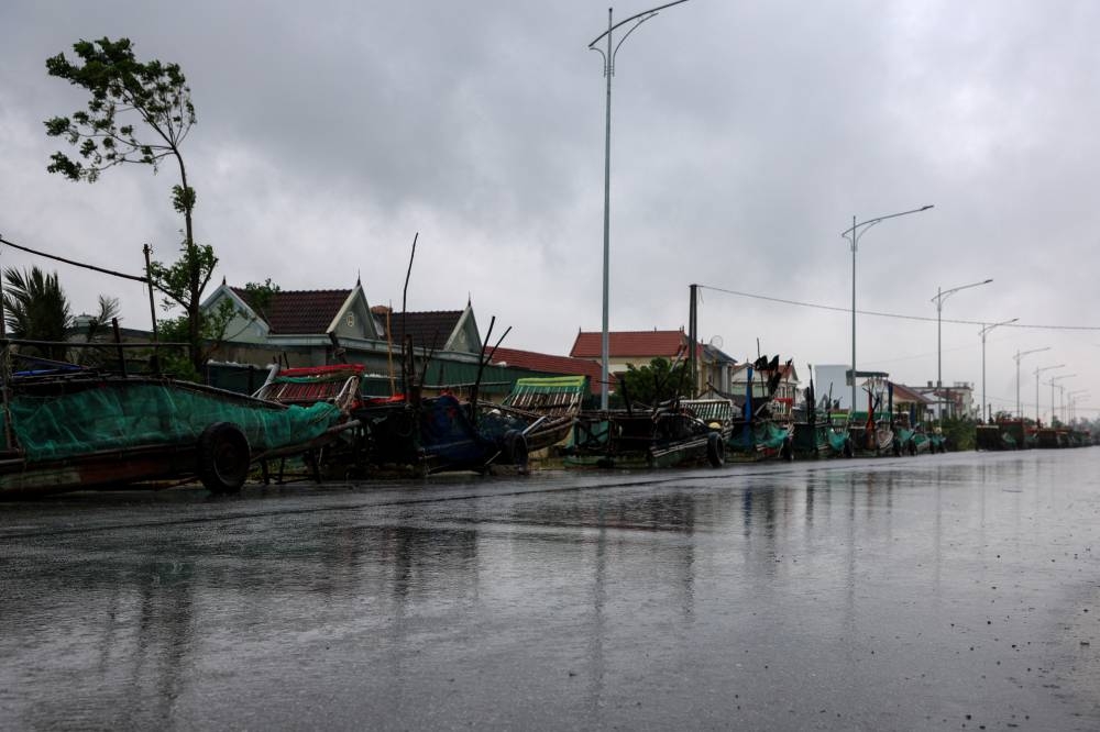 Boats are kept on a road as Typhoon Bualoi nears, in Nghe An province, Vietnam, on Sunday. REUTERS