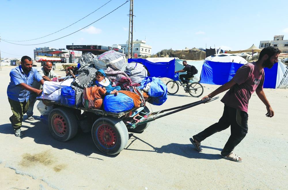 Displaced Palestinians, fleeing northern Gaza due to an Israeli military operation, move southward after Israeli forces ordered residents of Gaza City to evacuate to the south, in the central Gaza Strip, on Sunday. REUTERS