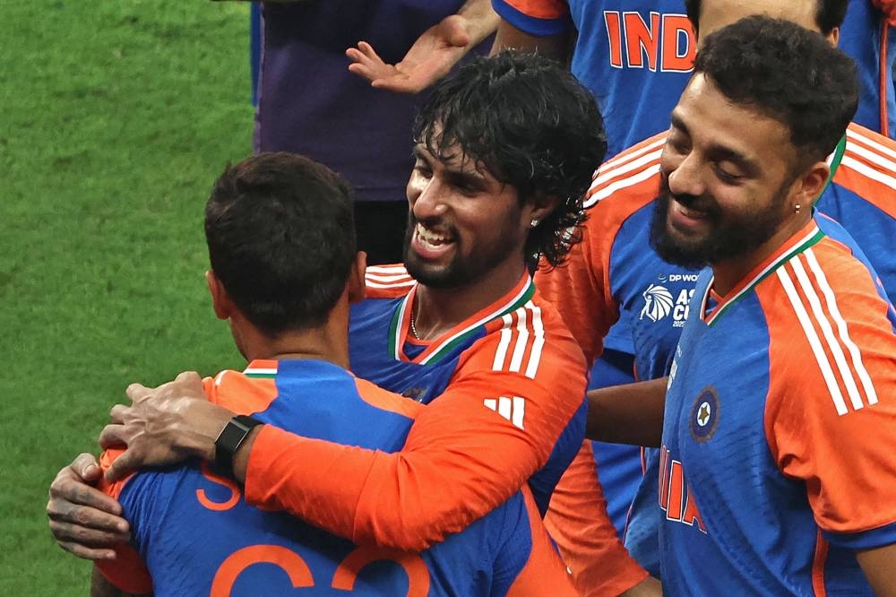 India's Tilak Varma (C) celebrates with teammates after winning the Asia Cup 2025 final Twenty20 international cricket match between India and Pakistan at the Dubai International Stadium in Dubai. AFP