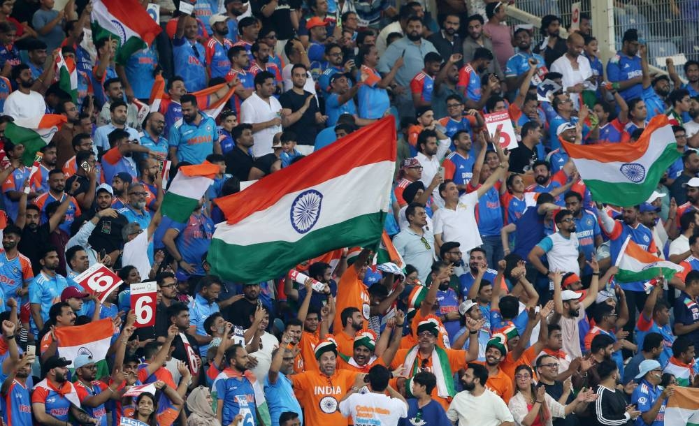  India fans celebrate at Dubai International Cricket Stadium. REUTERS