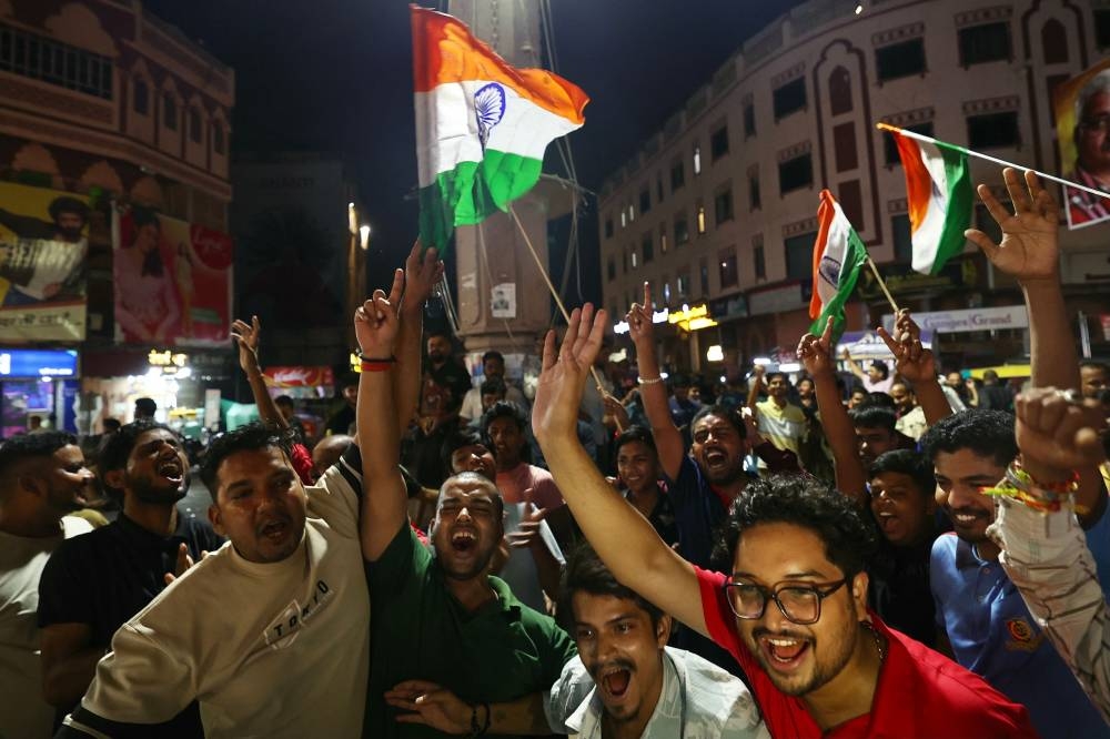 Indian cricket fans celebrate India’s victory at the end of the Asia Cup 2025 Twenty20 international cricket final match between India and Pakistan, in Varanasi. AFP