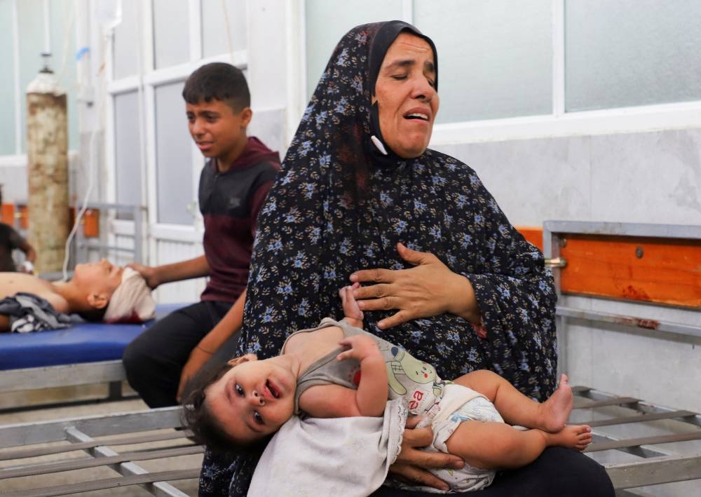 Wounded Palestinians receive treatment at Al-Shifa Hospital after being injured in an Israeli strike, amid an Israeli military operation, according to medics, in Gaza City, on Monday. REUTERS