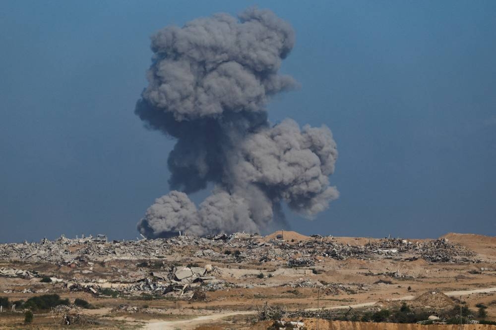 Smoke rises from Gaza after an explosion, as seen from the Israeli side of the border, on Tuesday. REUTERS