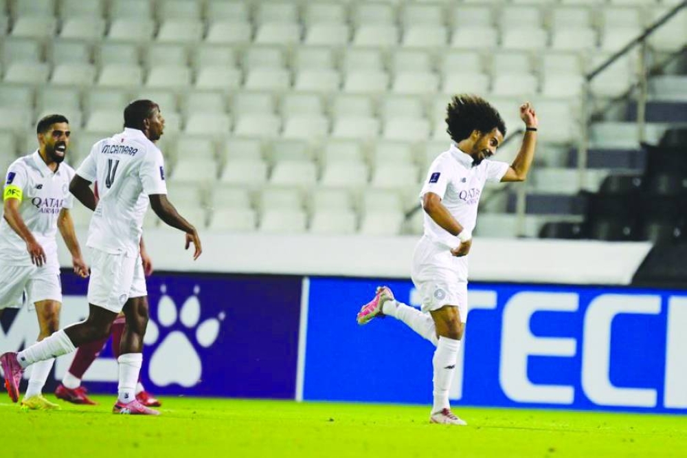 Al Sadd’s Akram Afif celebrate scoring a goal against Sharjah FC during their their AFC Champions League Elite 2025/26 match at the Jassim Bin Hamad Stadium in Doha Tuesday. Right:  Al Sadd goalkeeper Meshaal Barsham saves a penalty.