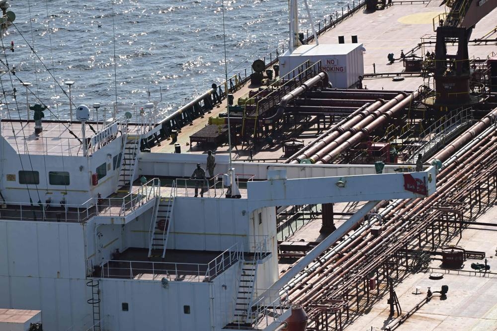 French soldiers onboard the tanker from Russia's so-called "shadow fleet" suspected of being involved in drone flights over Denmark which sailed off the Danish coast between September 22 and 25. AFP