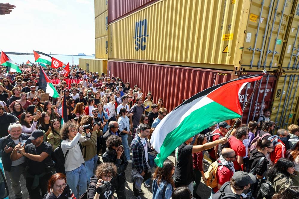 Pro-Palestinian protesters demonstrate inside the commercial port of Naples during a nationwide strike, in Naples, Italy, on Friday. REUTERS